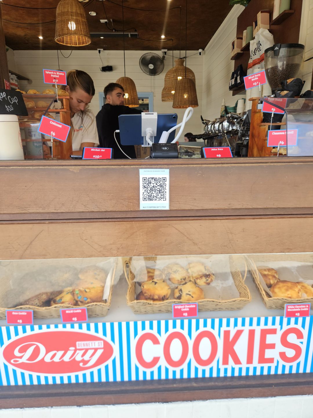 Bennett St Dairy's counter in Bondi, with the loyalty card QR code displayed at customer eye level beneath the EFTPOS terminal